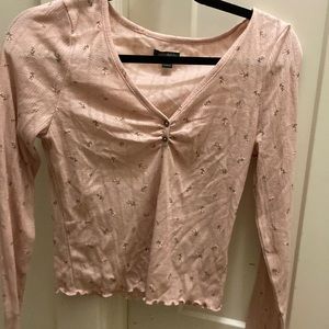 light pink low cut long sleeve shirt